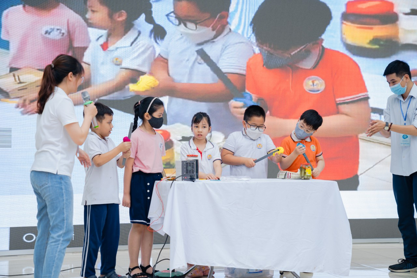 A group of people standing around a table with a person in a garment

Description automatically generated with low confidence
