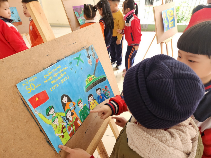 A picture containing text, person, child, indoor

Description automatically generated