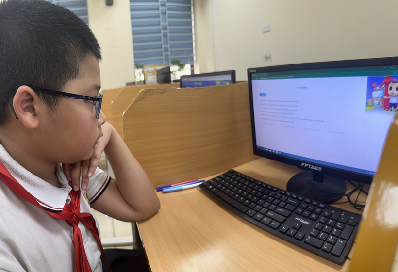 A child sitting at a desk with a computer and a keyboard

Description automatically generated with low confidence