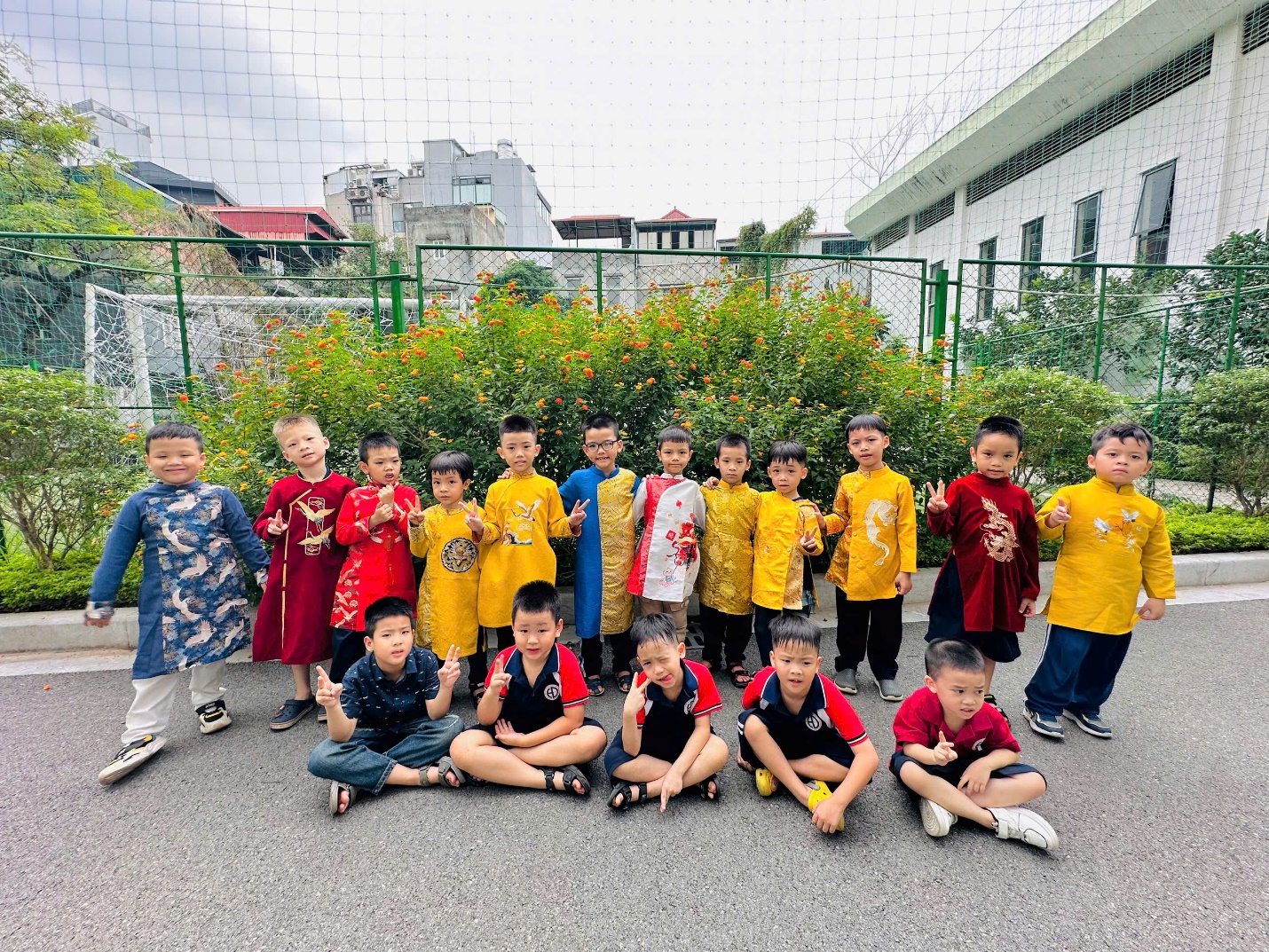 A group of children posing for a photoDescription automatically generated