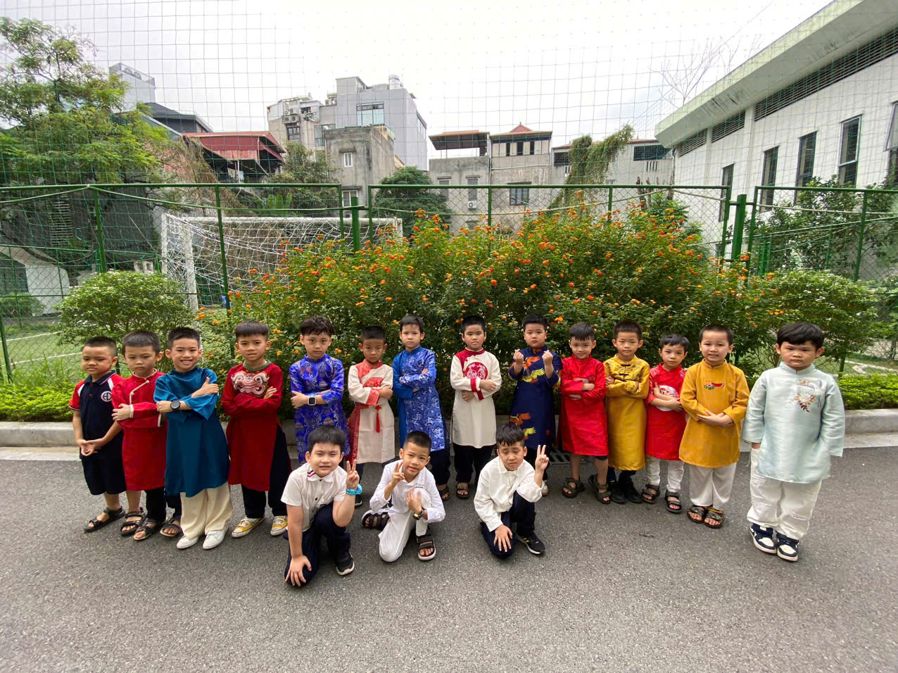 A group of children posing for a photoDescription automatically generated