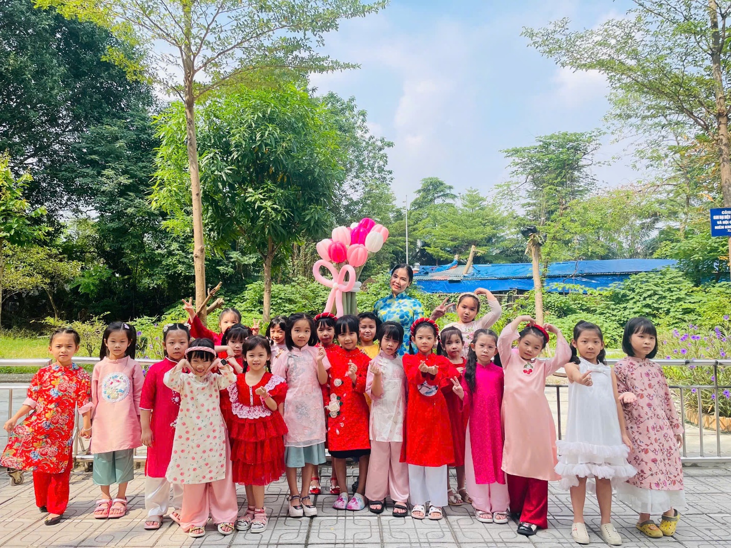 A group of children posing for a photoDescription automatically generated