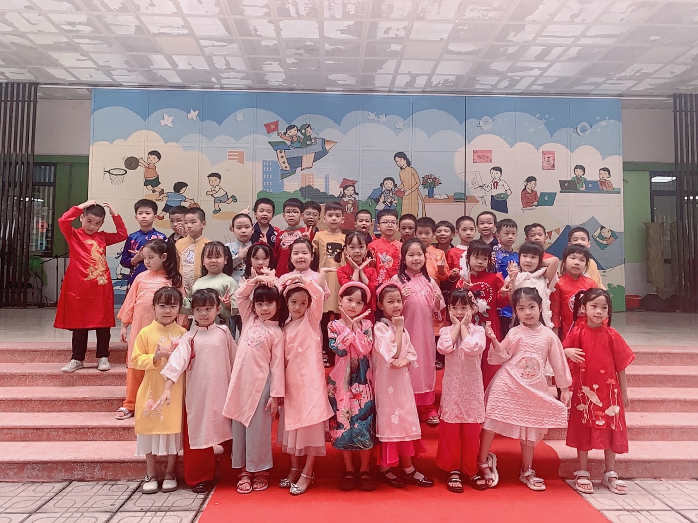 A group of children posing for a photoDescription automatically generated
