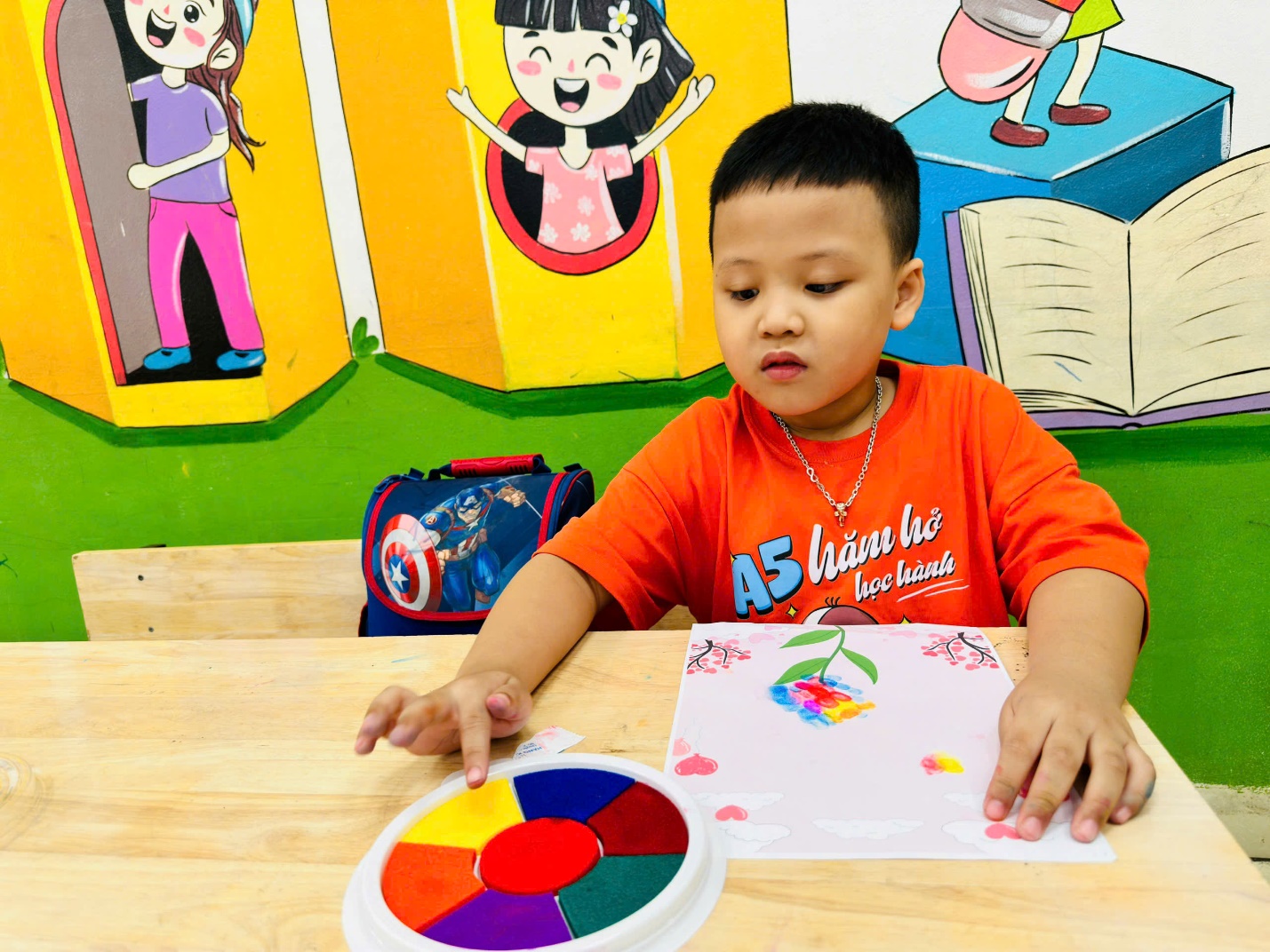 A child sitting at a table with a colorful puzzleDescription automatically generated