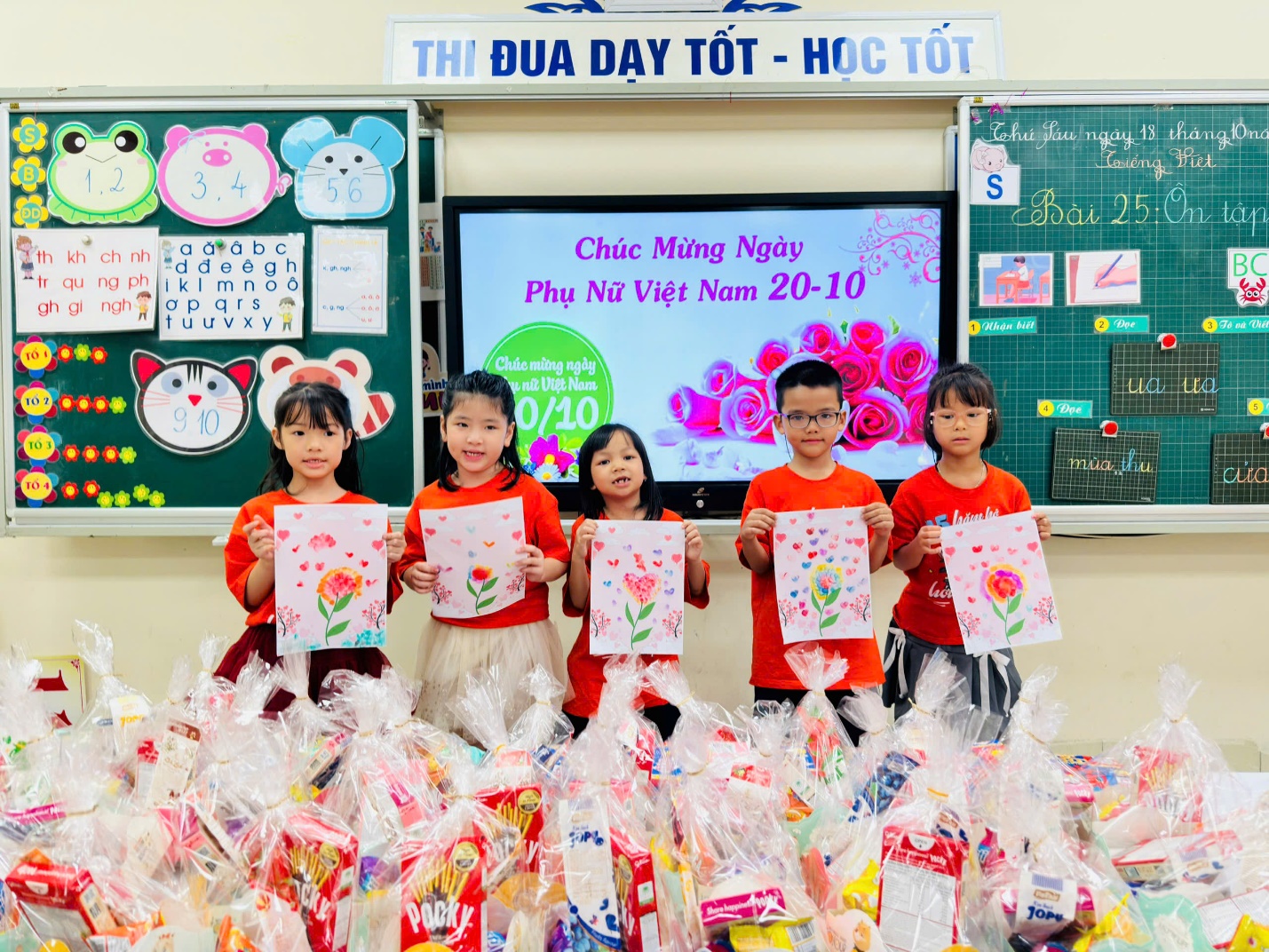 A group of children holding up a paperDescription automatically generated