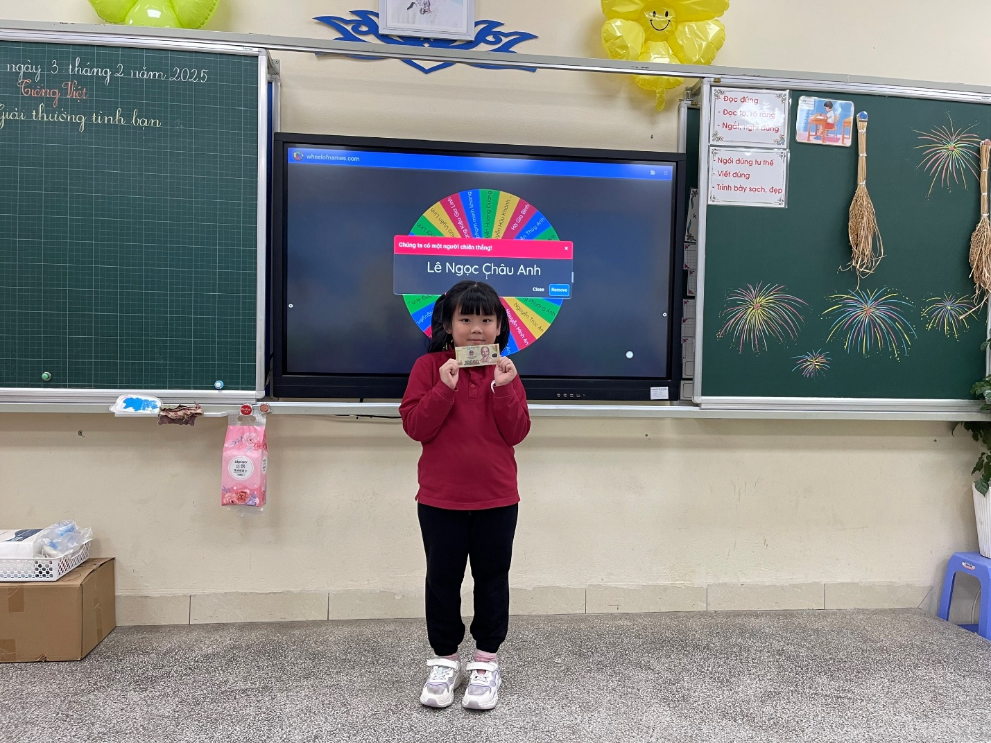 A child standing in front of a televisionDescription automatically generated