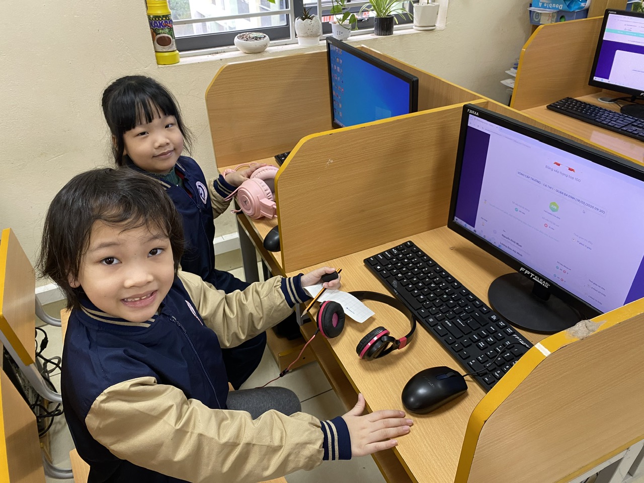 Two children sitting at a computer desk

AI-generated content may be incorrect.