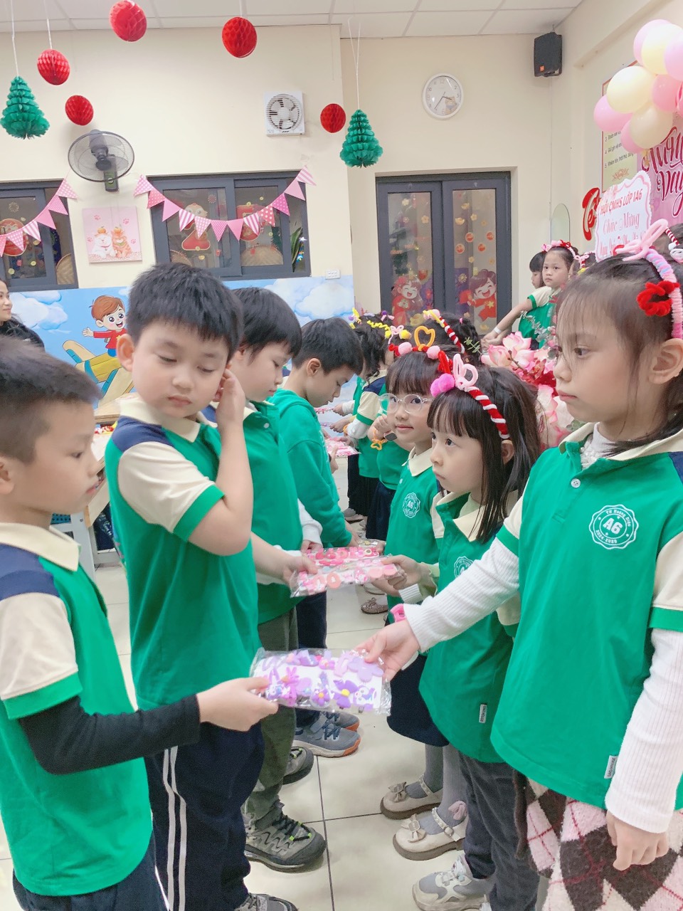 A group of children in green shirtsAI-generated content may be incorrect.