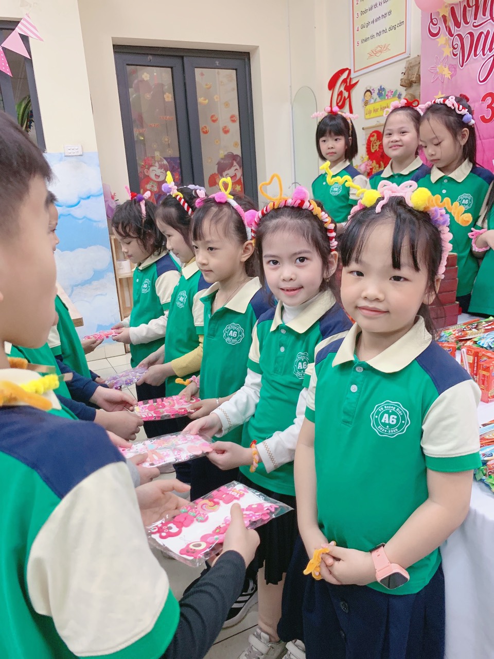 A group of children in green shirtsAI-generated content may be incorrect.