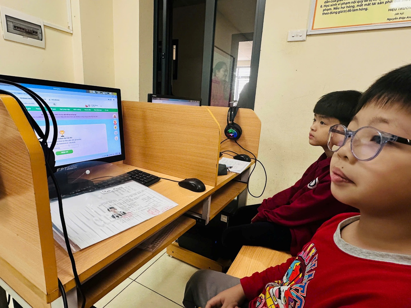A group of kids looking at a computerAI-generated content may be incorrect.