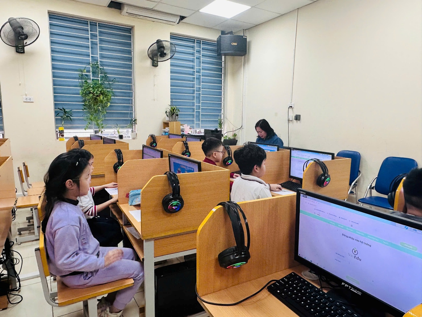 A group of children in a classroomAI-generated content may be incorrect.