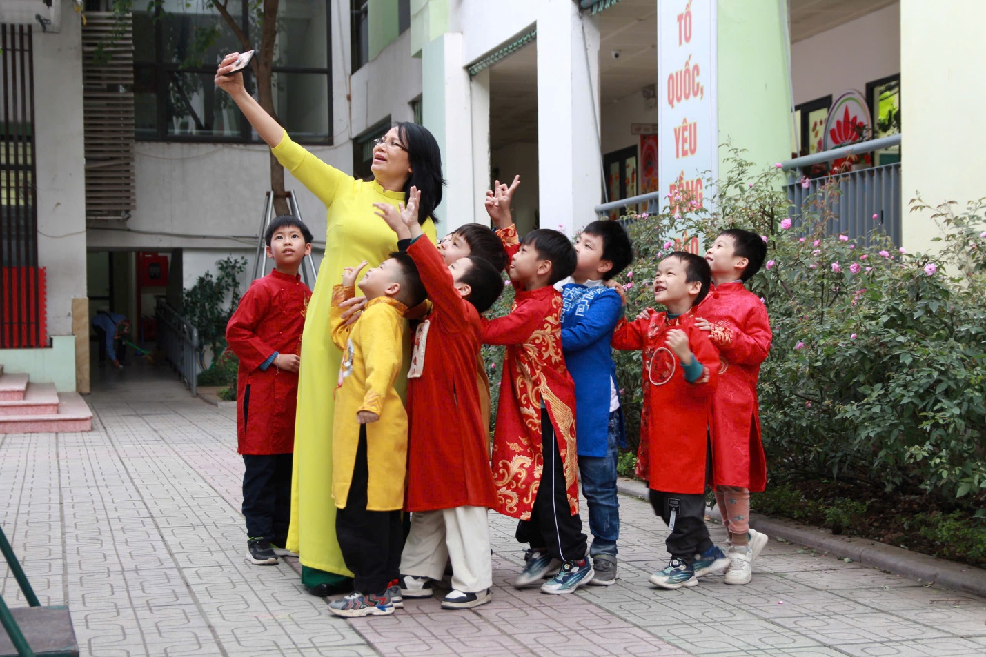 A group of children standing on a sidewalkAI-generated content may be incorrect.