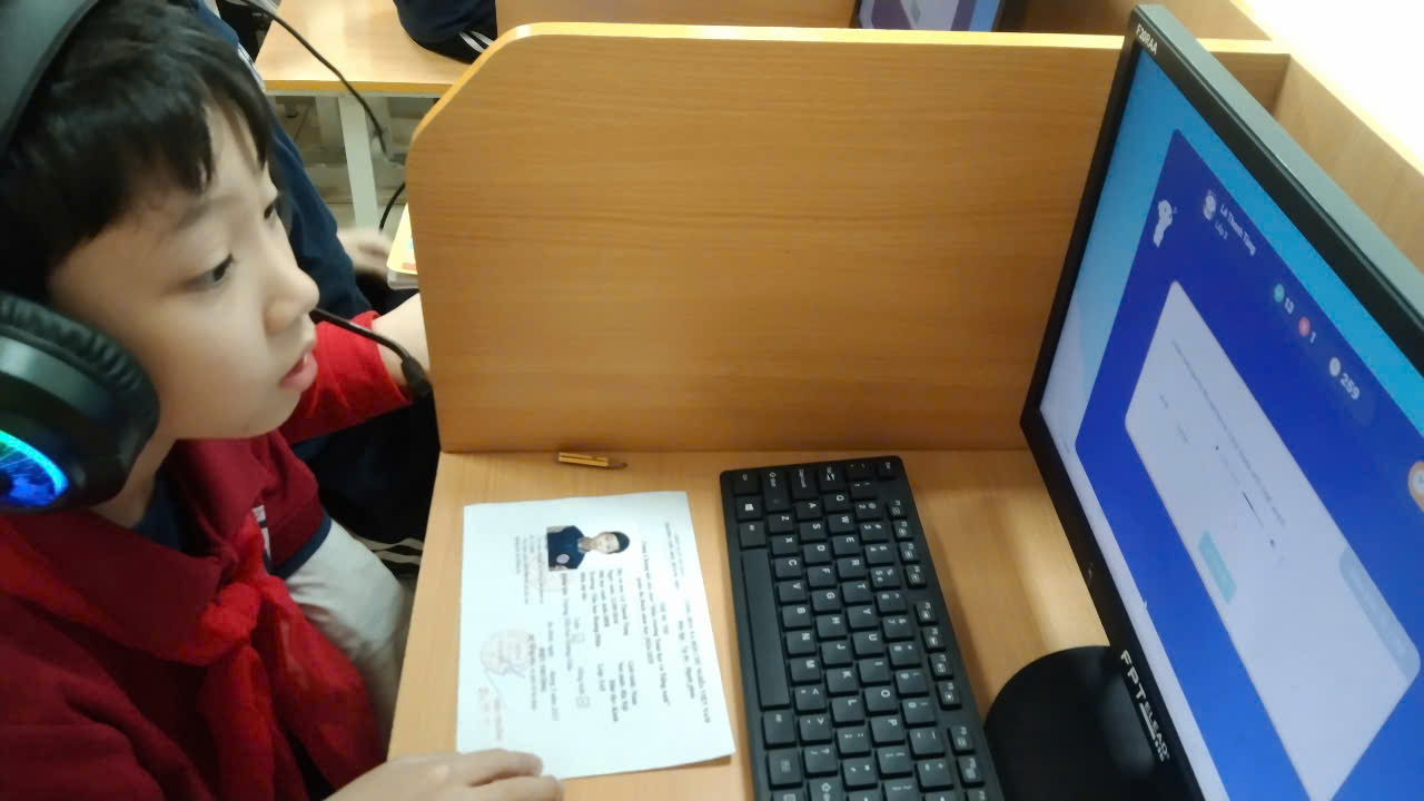 A person sitting at a desk with a computerAI-generated content may be incorrect.