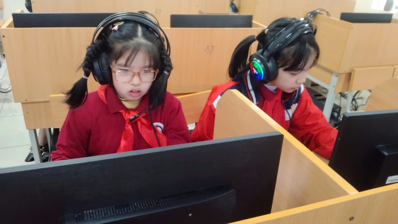 A couple of girls wearing headphonesAI-generated content may be incorrect.