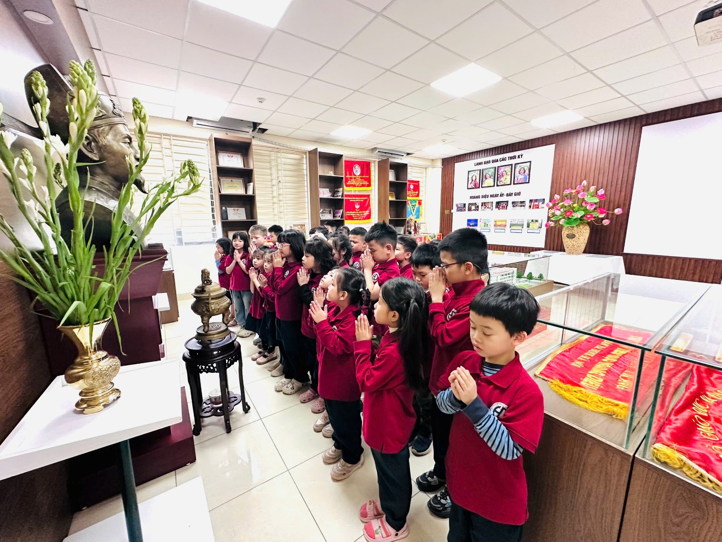A group of children in a lineAI-generated content may be incorrect.