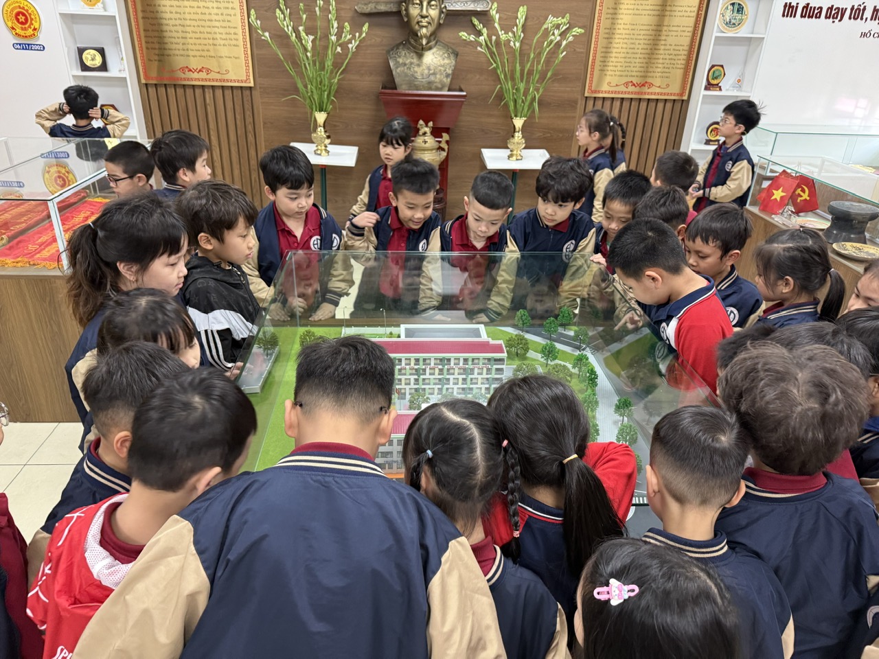 A group of children around a glass tableAI-generated content may be incorrect.