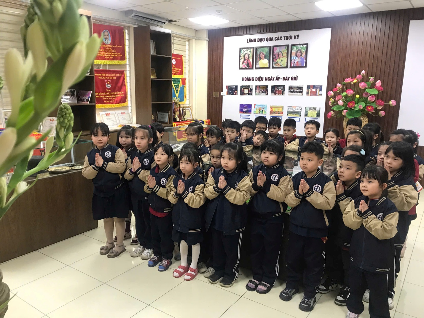 A group of children in uniformAI-generated content may be incorrect.
