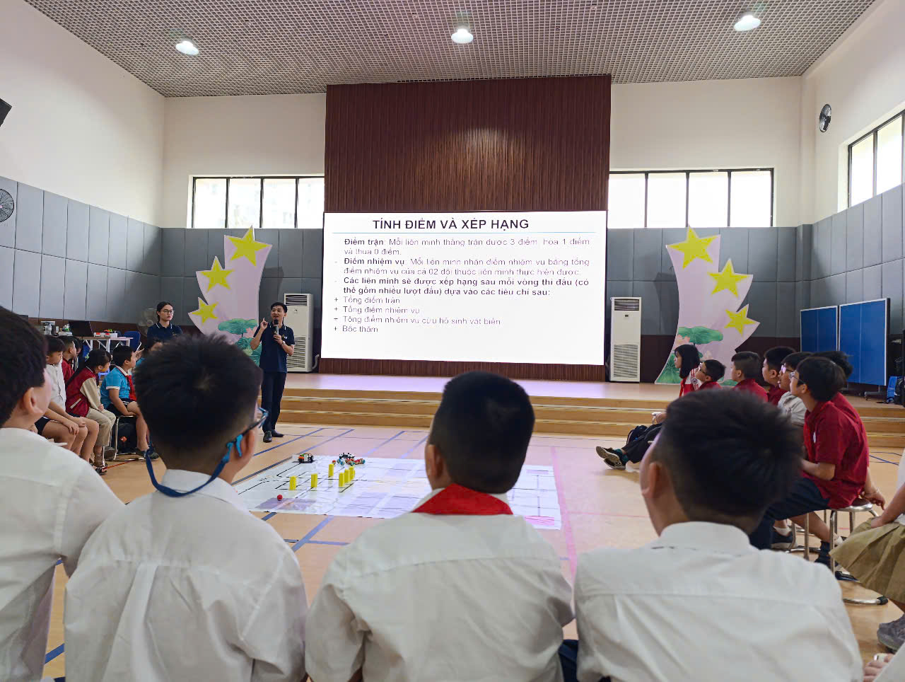 A group of children in a roomAI-generated content may be incorrect.