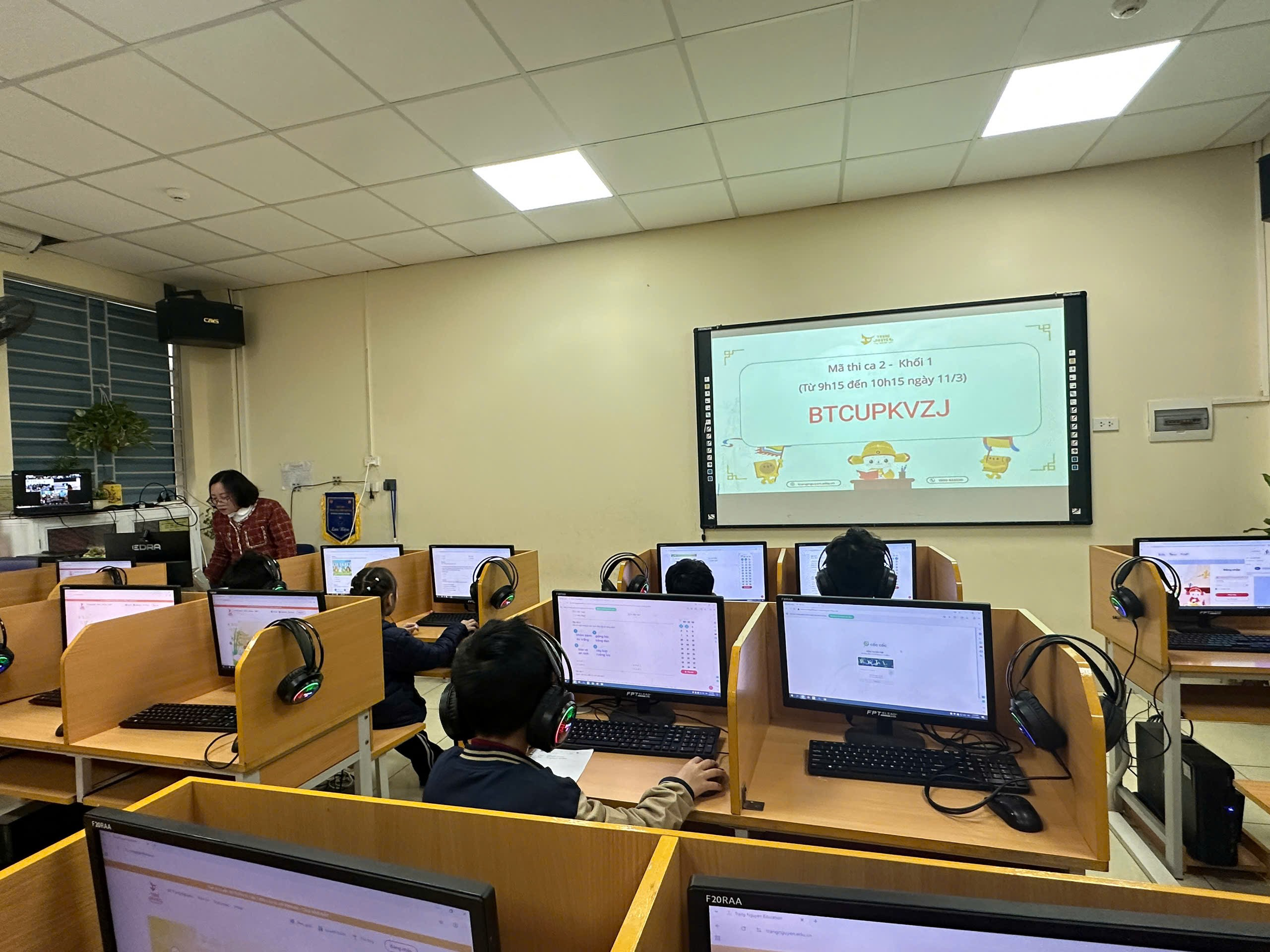 A group of people in a room with computersAI-generated content may be incorrect.