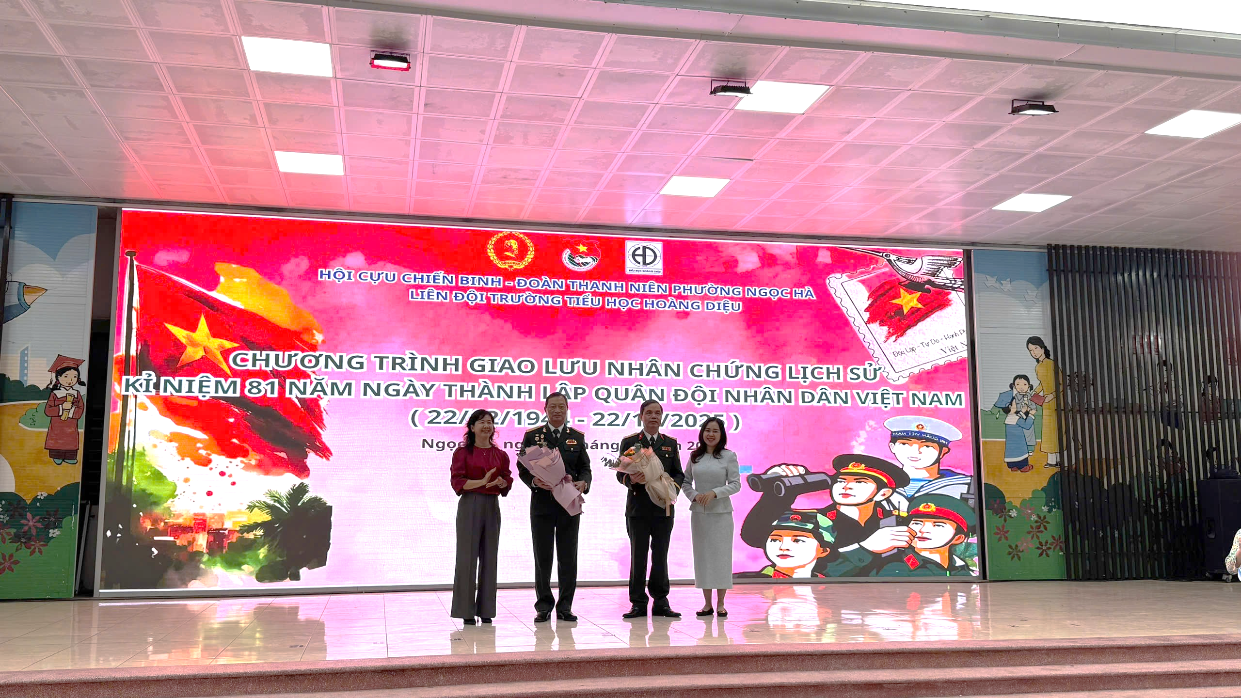 A group of people standing in front of a large screenAI-generated content may be incorrect.