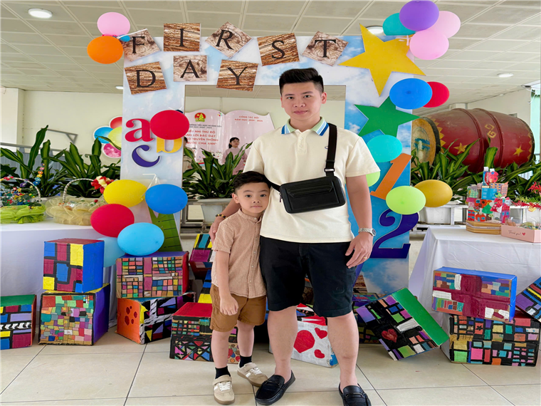 A person and child standing in front of a birthday partyAI-generated content may be incorrect.