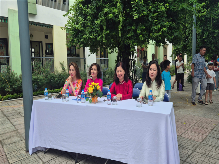 A group of women sitting at a tableAI-generated content may be incorrect.