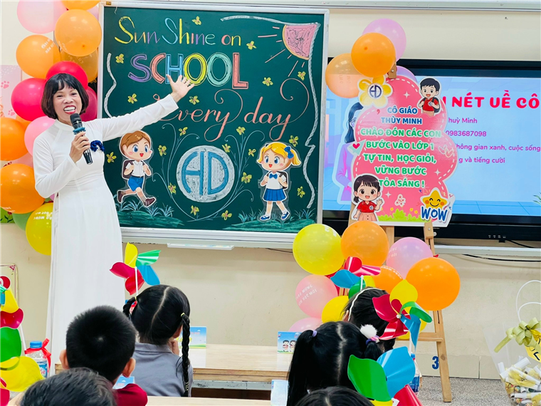 A person in a white dress standing in front of a chalkboard with a microphoneAI-generated content may be incorrect.