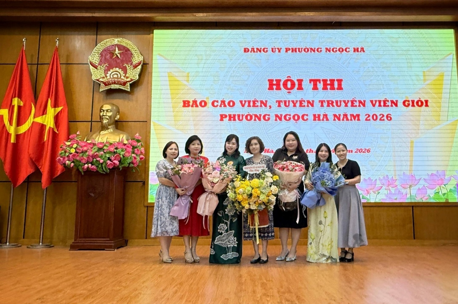 A group of women standing in front of a screenAI-generated content may be incorrect.